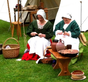 Camp women making repairs