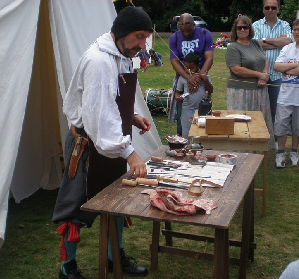 Barber-surgeon showing his equipment